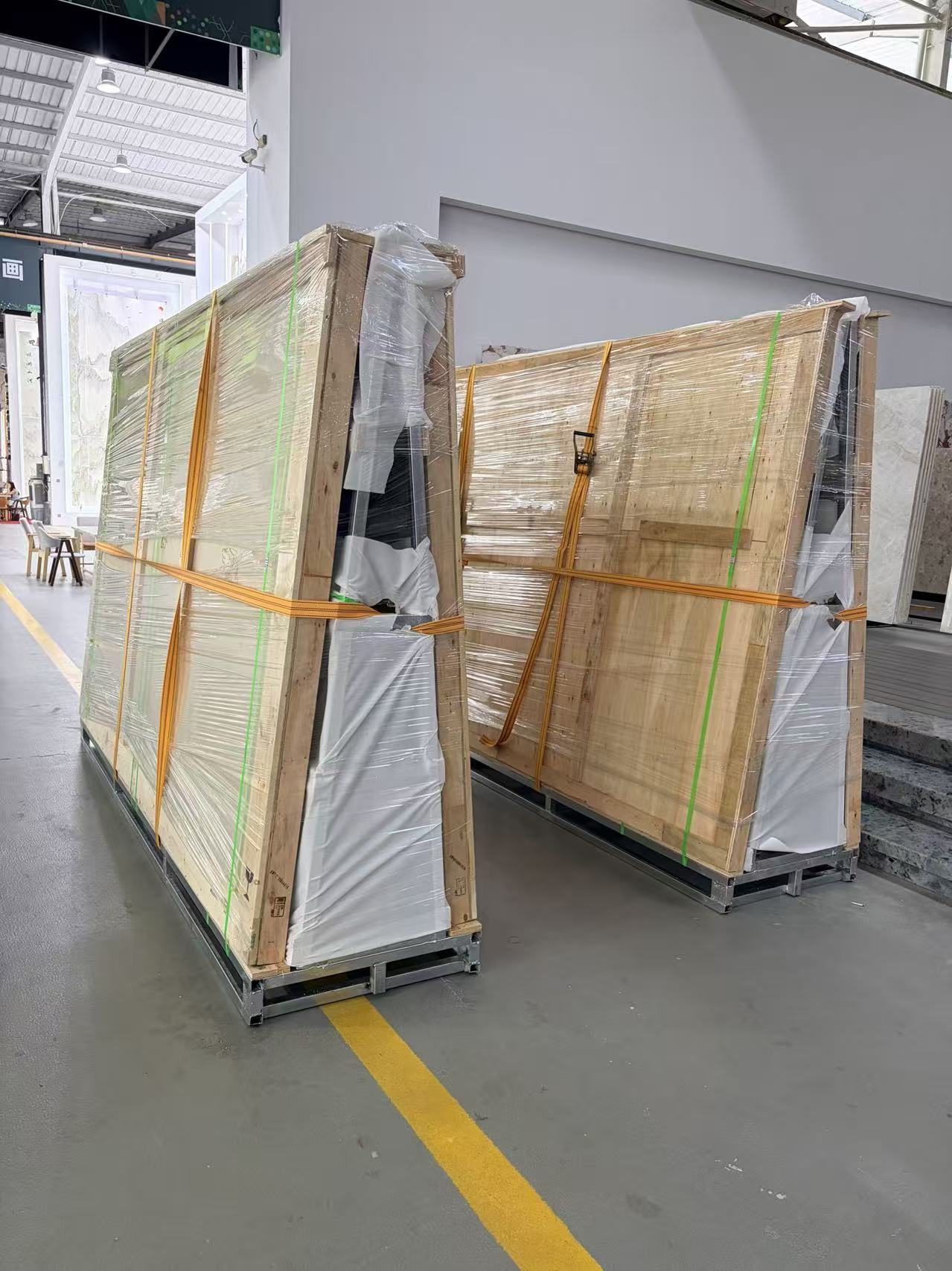 Stone slabs packed in angled A-frame crates for LCL shipping