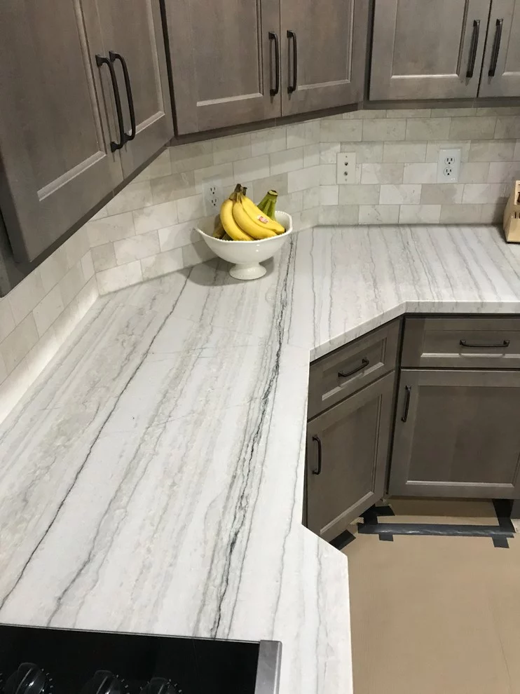 White Macaubas quartzite countertop with fine linear grey movement