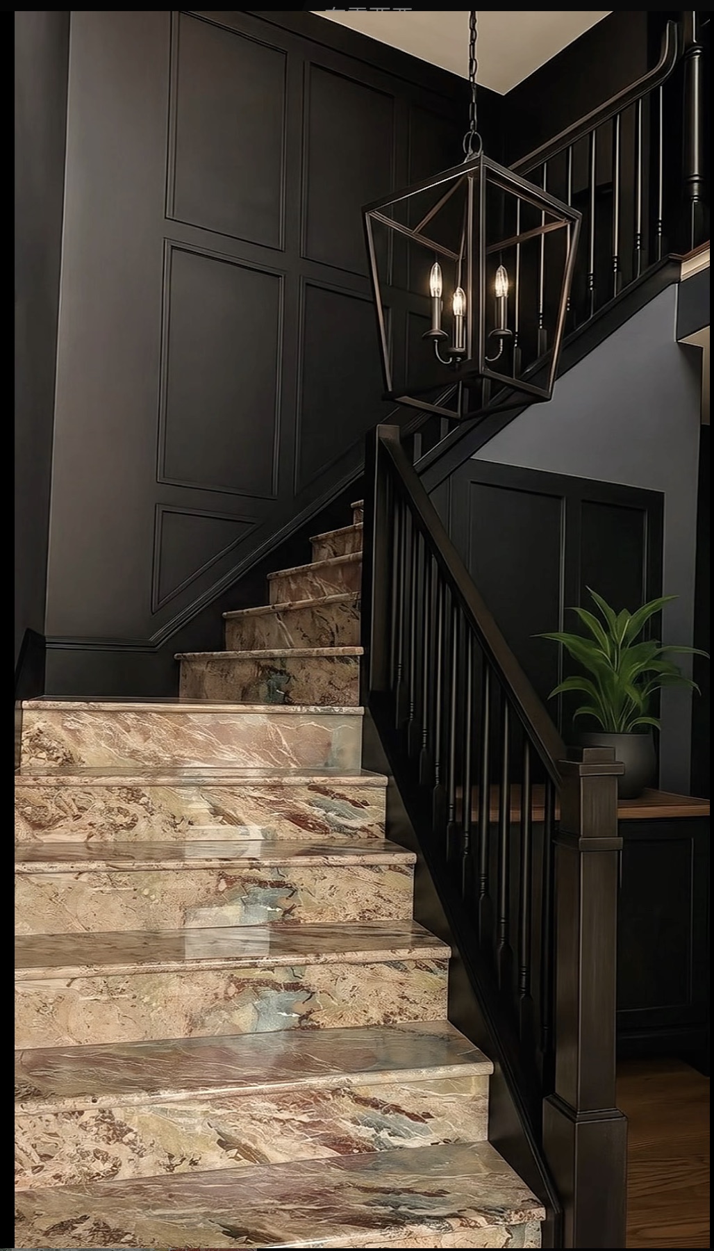 Breccia Botticelli Italian marble staircase with pink, green, and beige movement in a dark-panelled interior
