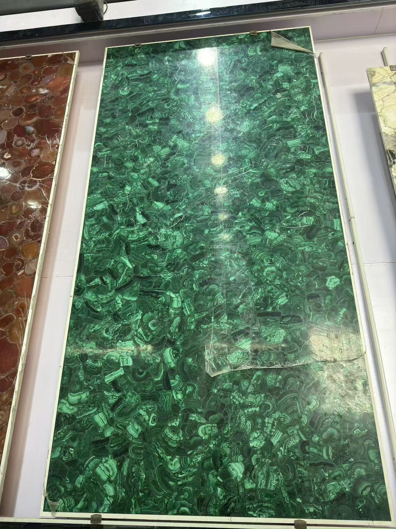 Full decorative slab assembled from vivid green malachite
