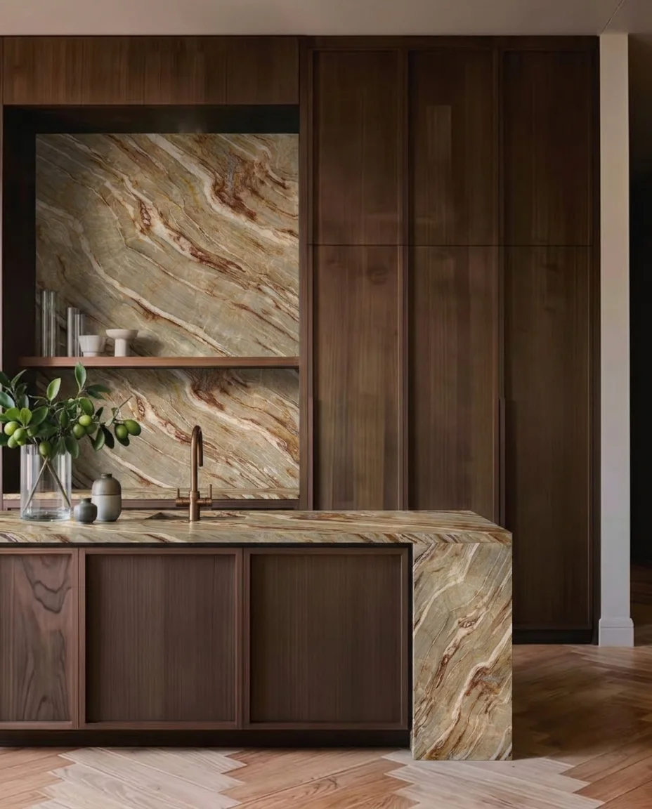 Nacarado quartzite island and backsplash paired with walnut cabinetry