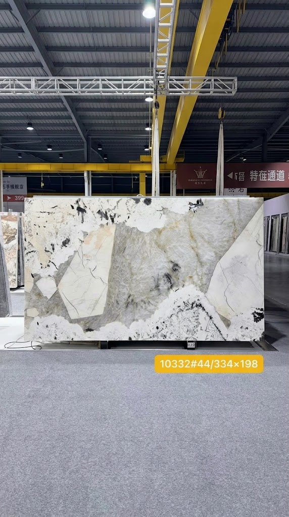 Full Patagonia natural stone slab with pale crystal fields and dark mineral fragments