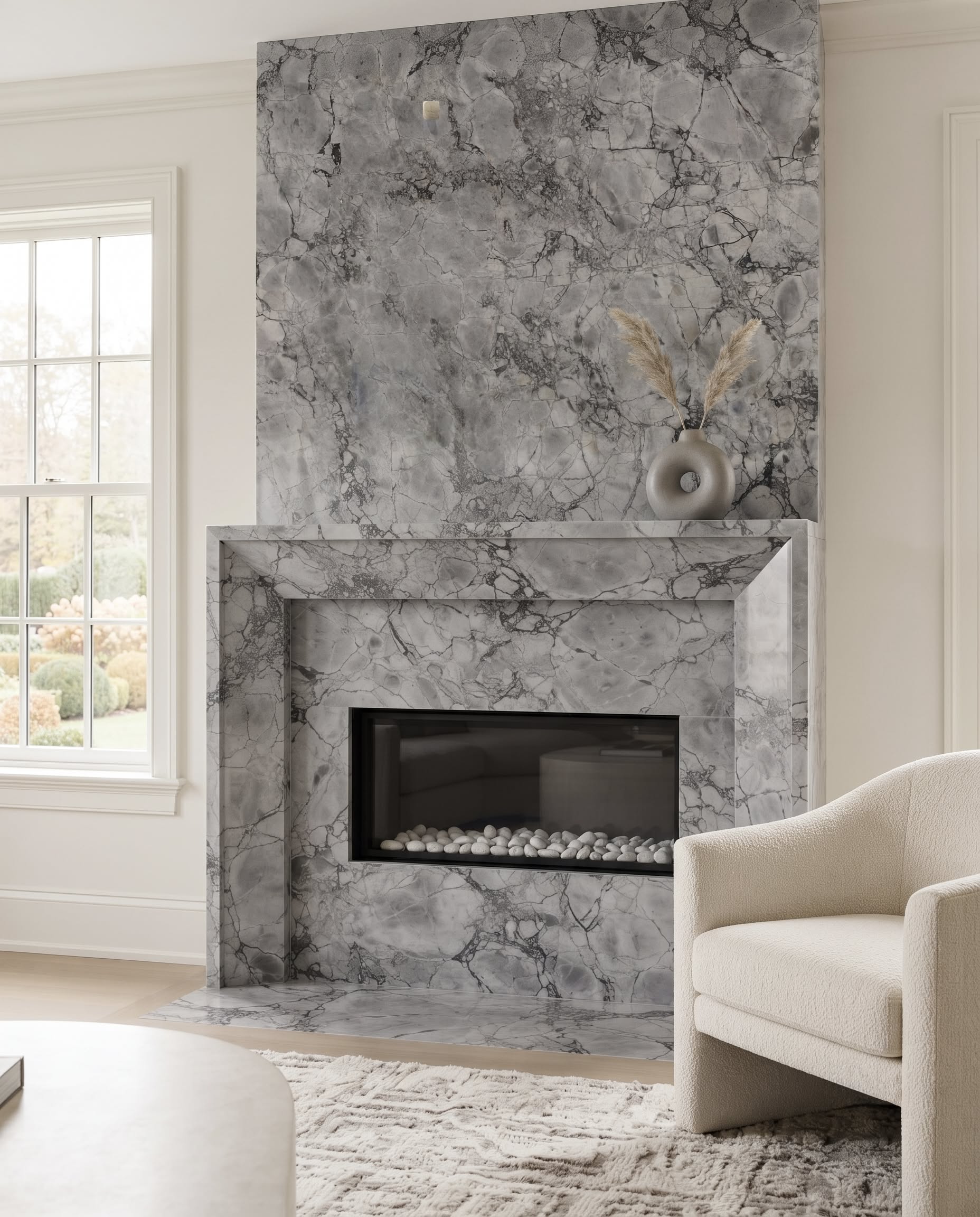 Super White natural stone fireplace surround in a light neutral living room